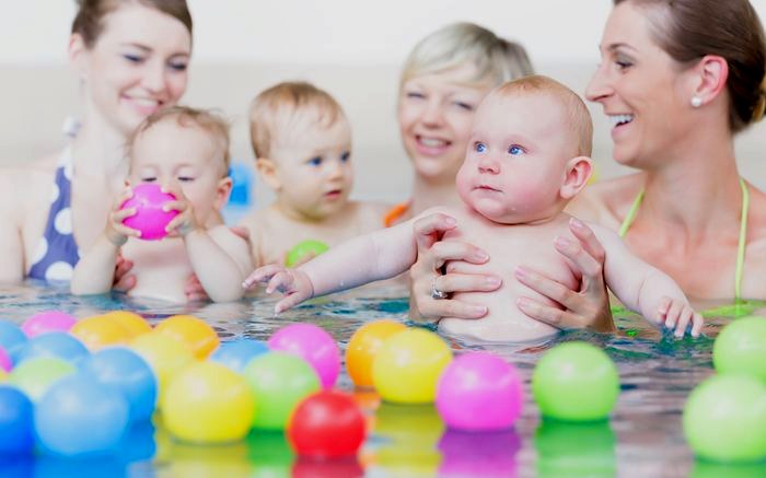 A parent and baby in the water during a Swimmable baby class